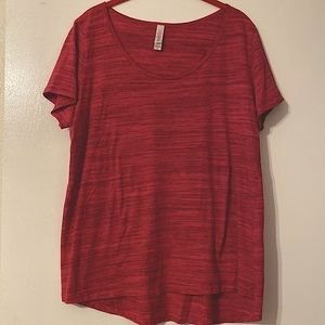 Raspberry color tee shirt. Back comes down further than front.